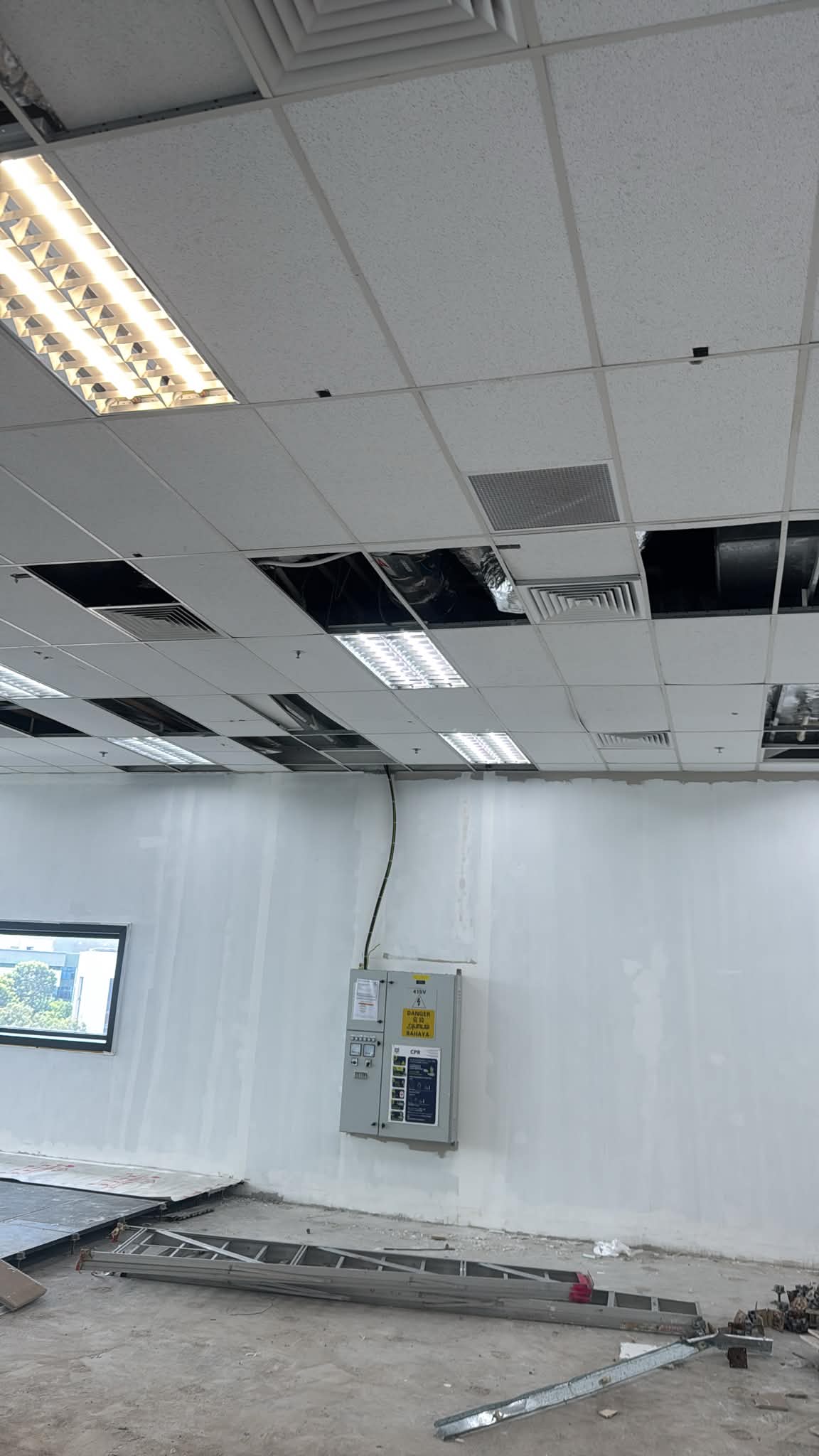 AR Engineering Ceiling Partition Singapore — ceiling tile and light fitting installation in an office